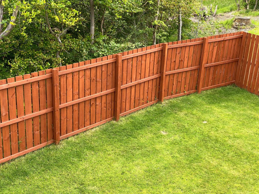 Cedar fence staining project by Magna Painting