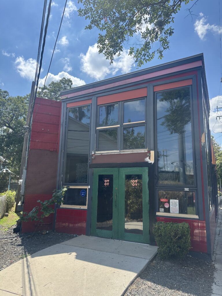 Freshly painted black and white commercial storefront exterior in San Antonio, TX